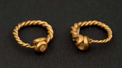 Gold pair of roman earrings