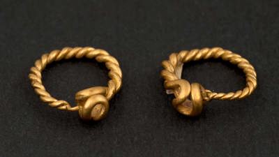 Gold pair of roman earrings