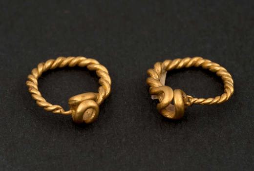 Gold pair of roman earrings