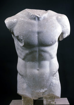 The limbless and headless statue of a torso of an athletic male.