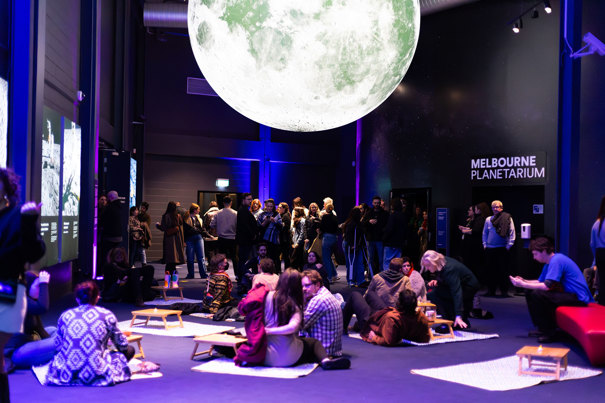 People picnicking under the moon at Scienceworks After Dark.