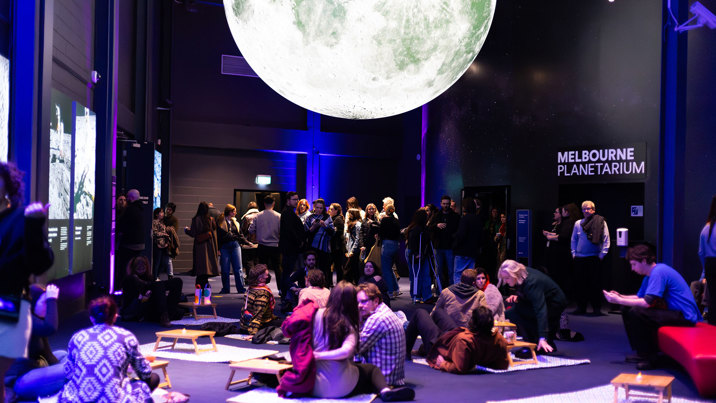 People picnicking under the moon at Scienceworks After Dark.