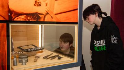  Secondary school students viewing the Leaving Home exhibition in Immigration Museum.