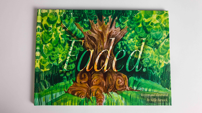 Hardback book whose cover features an illustrated tree with a thick, twisted trunk surrounded by green foliage.