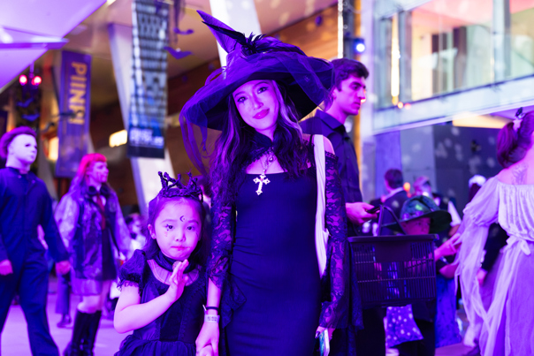 Mother and daughter in witch costume during Halloween at the Museum.