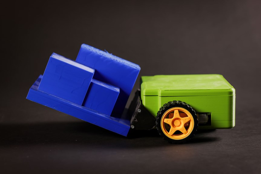 A green and blue system with black and orange wheels.