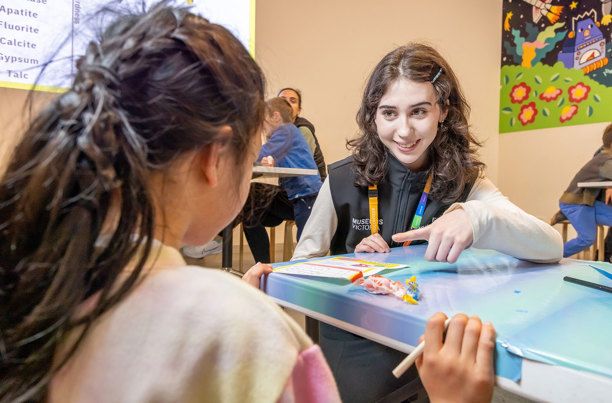 Child participating in a learning activity during Science is a Superpower festival at Scienceworks.