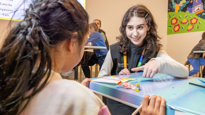 Child participating in a learning activity during Science is a Superpower festival at Scienceworks.
