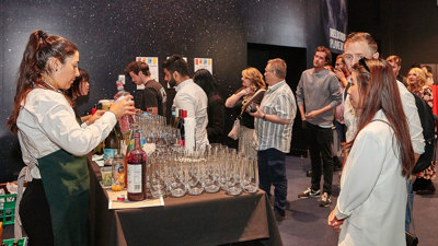 People enjoying the Valentine's Day themed events at Scienceworks with hospitality staff offering drinks.