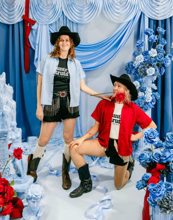 Two women in western clothing and shirts that say Country Struts