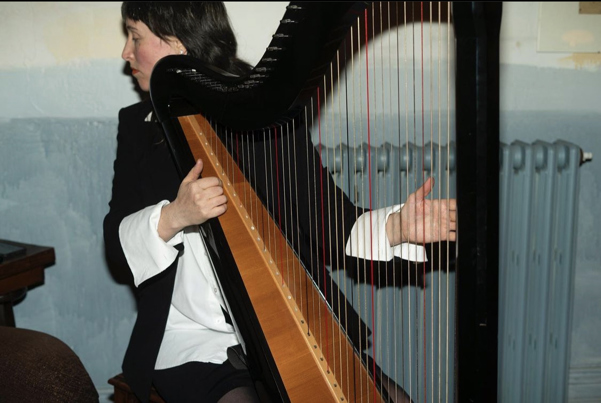 Woman playing the harp