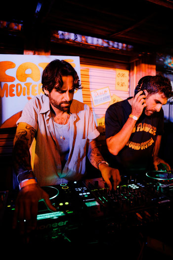 Two men djing together