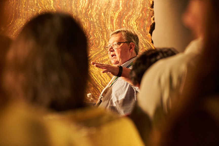 A tour guide leads a group of museum goers through the Dynamic Earth Exhibition.
