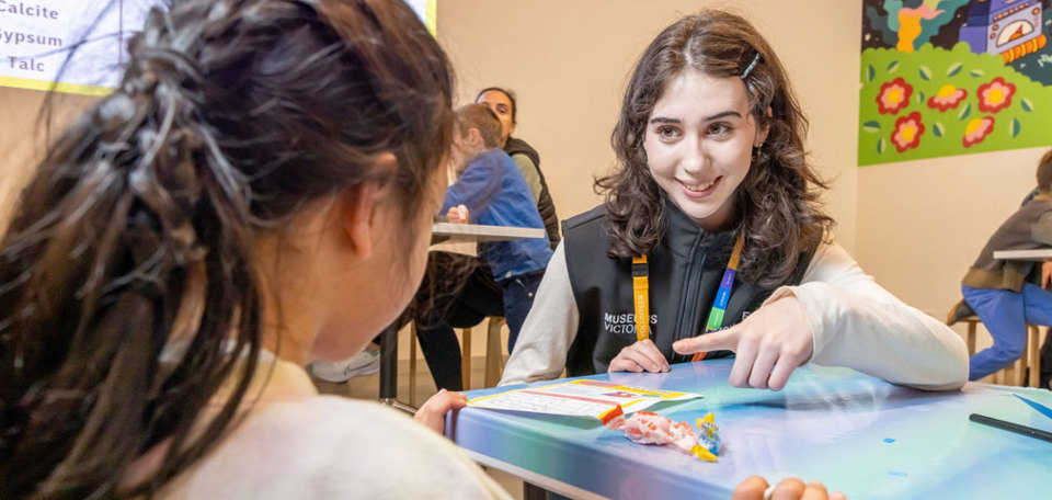 Volunteer engaged with a visitor