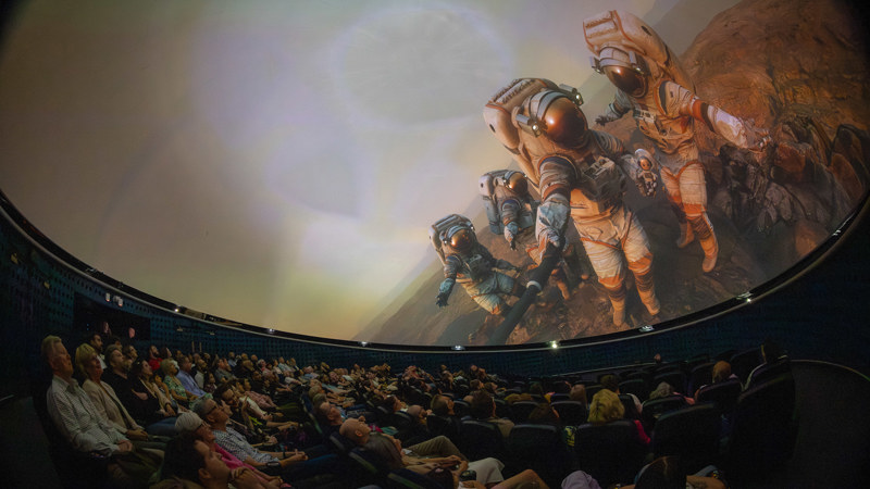 Planetarium audience looking up at the show One Step Beyond.