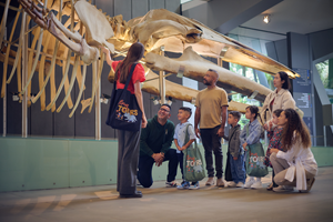 Tour group of young children and their carer's standing next to the Blue Whale