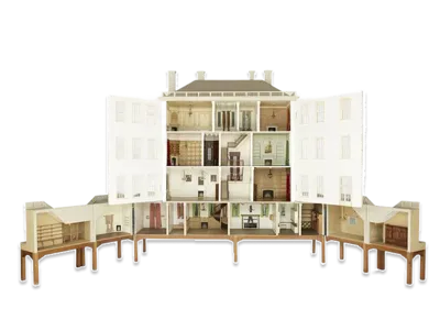 Large cutaway dolls' house revealing multiple furnished rooms and interior details across several floors.