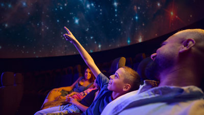 A family in the Scienceworks Planetarium in Melbourne.