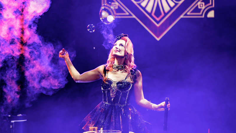 Becky Bubbles making smoke filled bubbles during her Magic Noir performance.