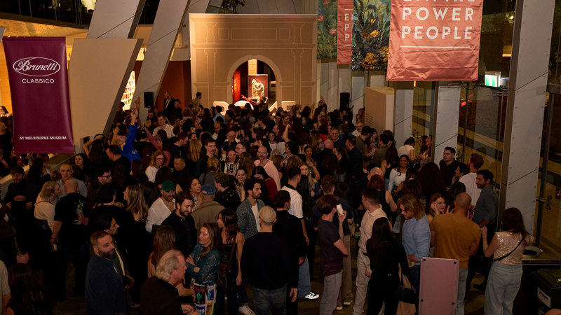 People in the foyer to the Rome exhibition during Discoteca Italiana, Melbourne Museum.
