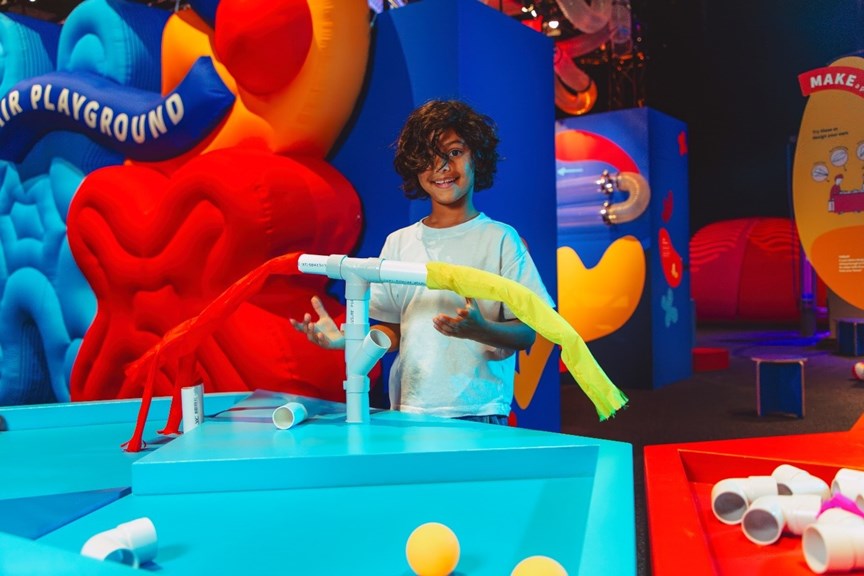 A boy using an interactive in the Air Playground exhibition. 