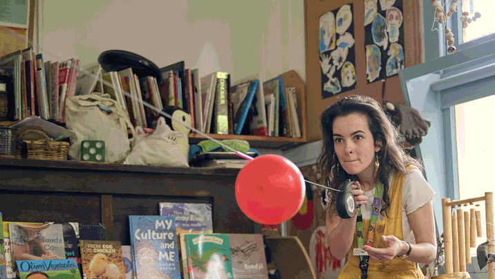 Aligning with early childhood learning outcomes, Museum Educator facilitates a science demonstration showing how rockets work using a balloon during Museum Victoria's Rockets and Robots kindergarten incursion program 