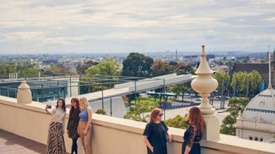 People taking selfies from the Dome Promenade rooftop.