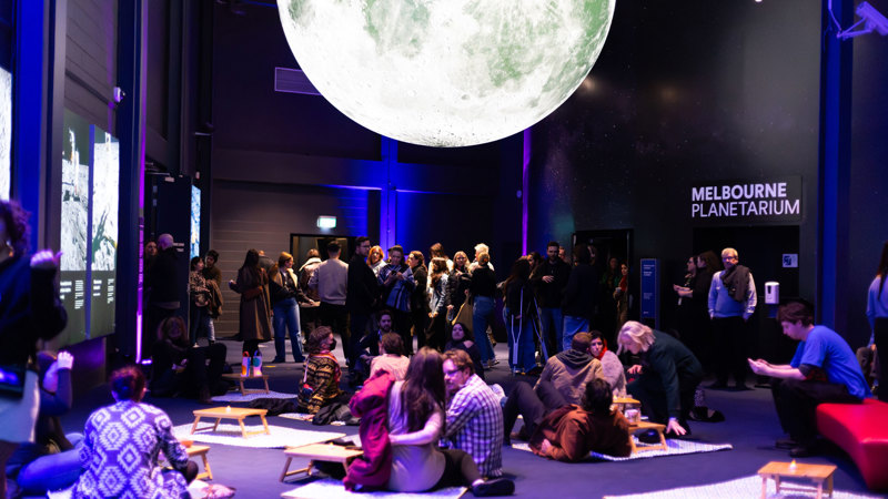 People picnicking under the moon at Scienceworks After Dark