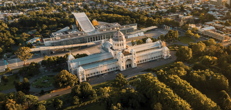 An ariel shot of the Royal Exhibition Building, Melbourne Museum and surrounding gardens.