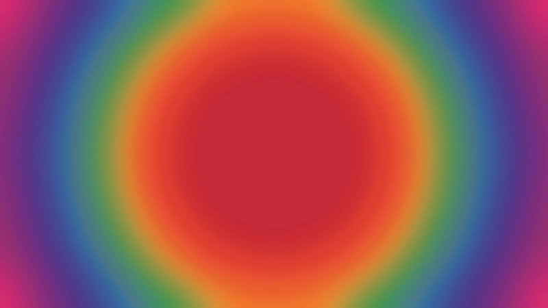 Radial gradient, transitioning from a circle of bright red-orange at the centre, into yellow, green, blue, purple and pink tones towards the edges.
