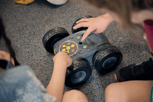 Kindergarten children building foundational skills in problem-solving, coding, and teamwork as they program a Rugged Robot during Museum Victoria's Rockets and Robots kindergarten incursion program 