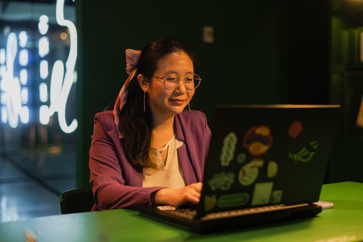 Michelle Chen at her laptop.