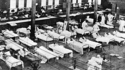 Black and white image of beds in the men's ward on the ground floor of the Exhibition Building, Melbourne.