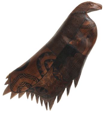 Carved bird figure with intricate geometric patterns