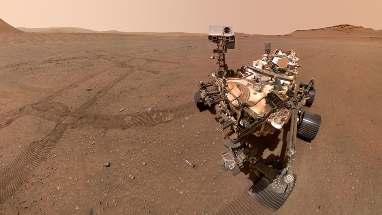 Rover on Mars with tyre marks in the red Martian soil