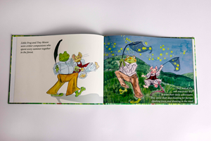 Open hardback book featuring text and cartoon illustrations of the characters Little Frog and Tiny Mouse.