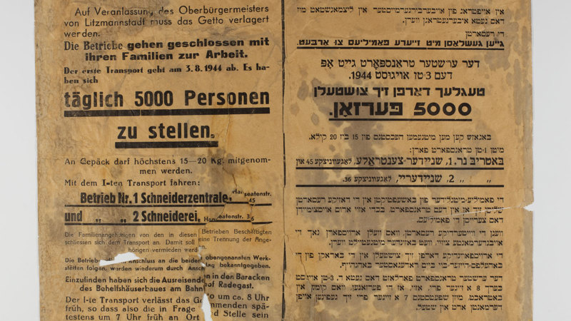 A printed document with black text in languages other than English.
