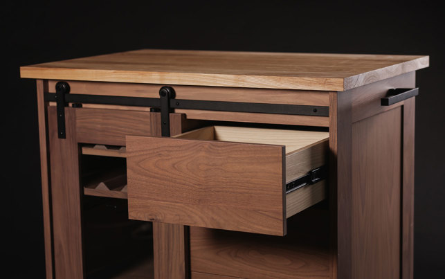 Wooden cabinet with one of its drawers pulled out.