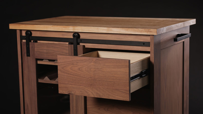 Wooden cabinet with one of its drawers pulled out.