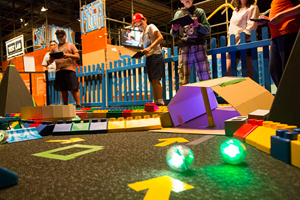 Children navigating their maze using iPads and Shero robots.